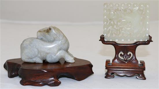 A Chinese pale celadon jade plaque, 18th / 19th century, 6.1cm, wood stand